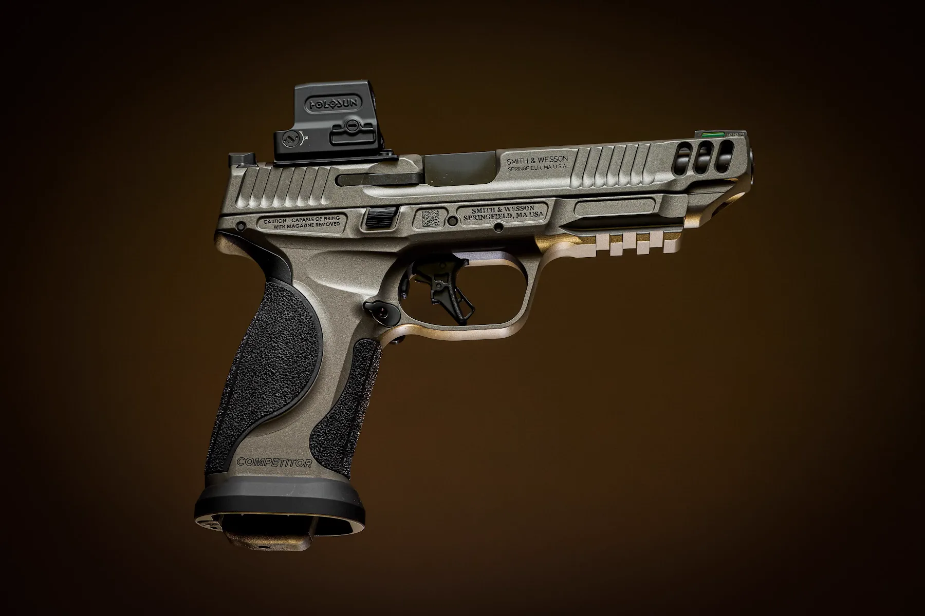 Custom pistol photographed against a warm brown background