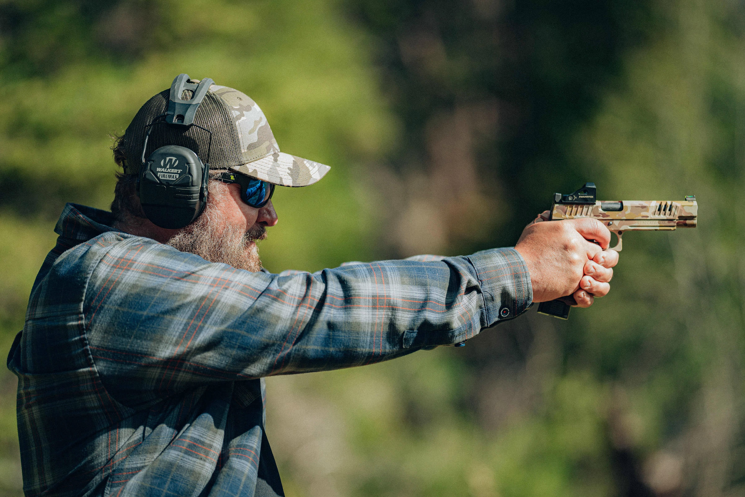 Shawn Herrin shooting at an outdoor range