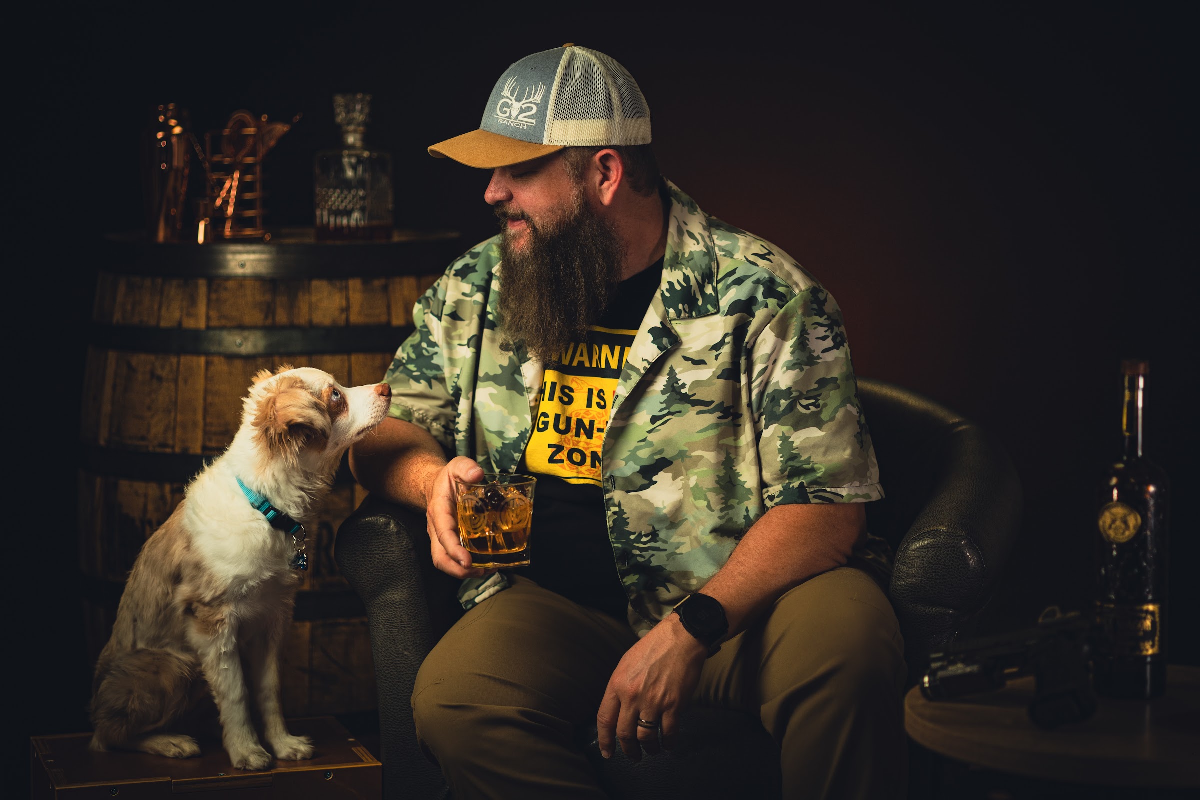 Shawn Herrin seated in a studio with his dog